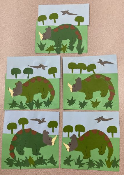 Dinosaur landscape from cut paper