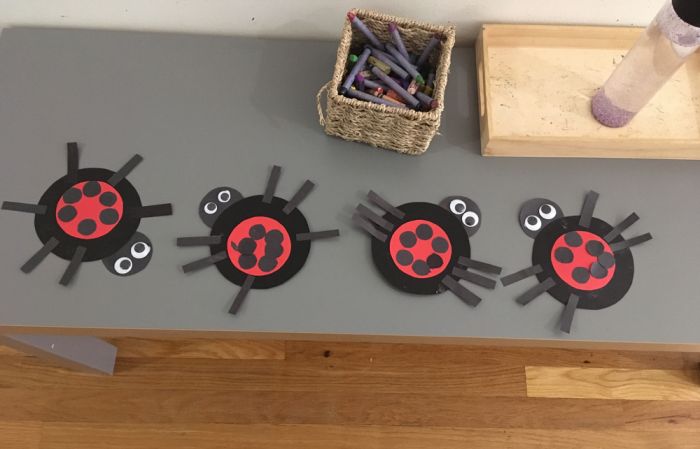 art students create little ladybugs