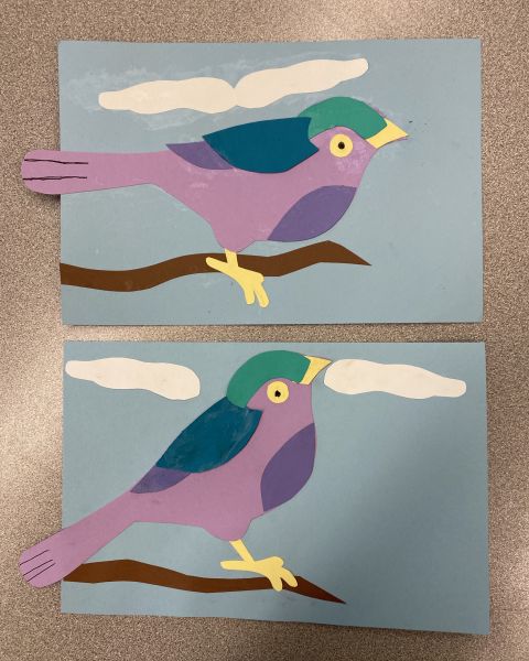 purple and blue green birds on a branch from cut paper